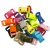 Multiple plastic buckles in various colors stacked in a pile, including red, pink, orange, olive green, light blue, lime green,