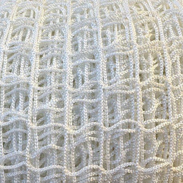 Close-up of a strong and flexible nylon silk net. Ideal for securing loads, trailers, and containment areas.