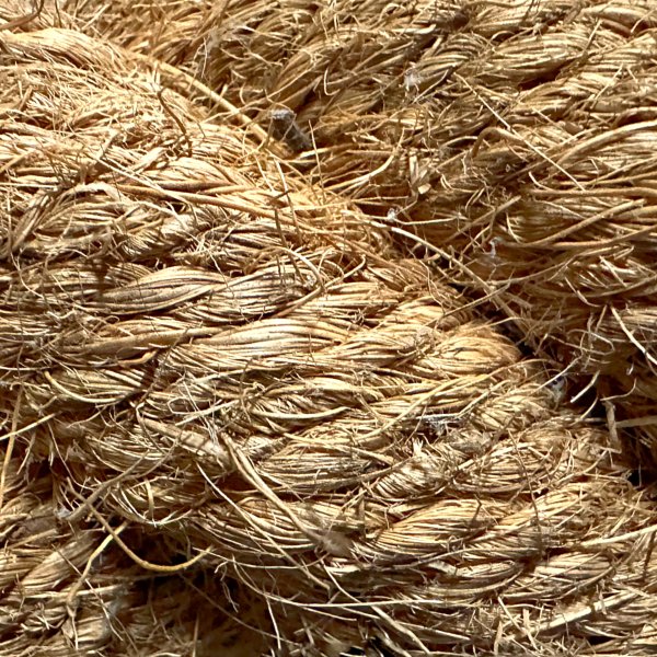 Close-up of a 68 mm thick 4-strand coconut rope. Commonly used as railing rope, fender rope, or decorative line.